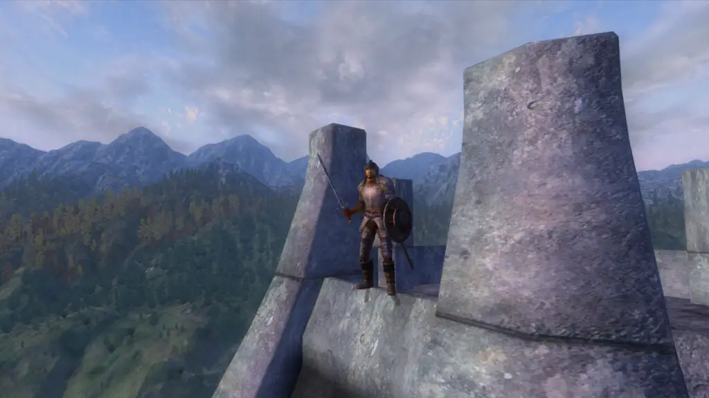 Oblivion - A character in metal armor standing at the top of a stonetower looking over the landscape