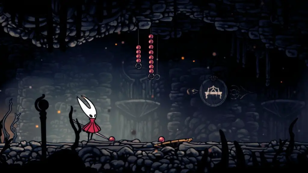 Hollow Knight: Silksong gameplay showing Hornet in a richly detailed environment, with a distinct red Rosary string visible.