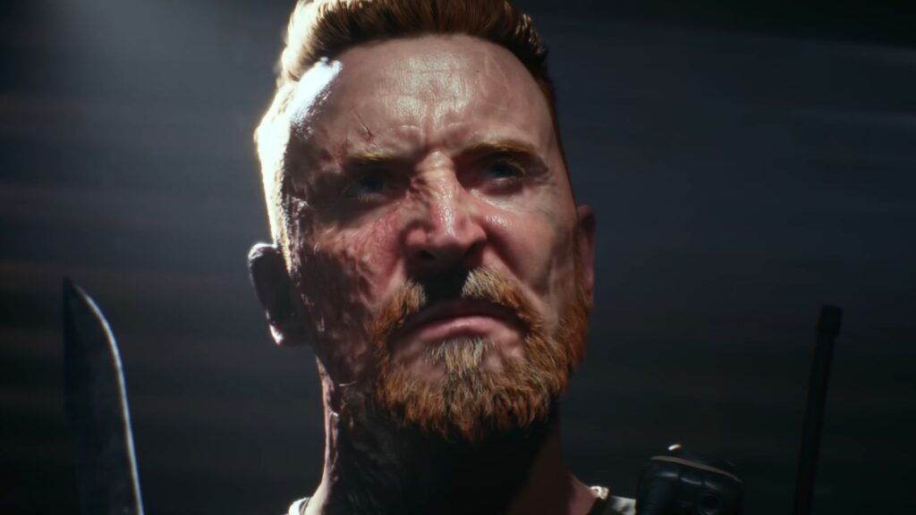 A soldier from Battlefield 6. He's got what appears to be a burn scar along his right side and is clenching his jaw while looking off screen. He seems to be under interrogation in a dark room