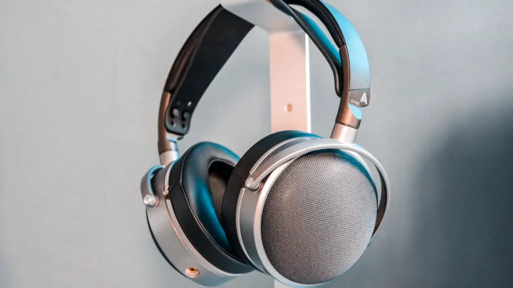 Two pairs of headphones. One, a SteelSeries set with ANC; the other, an Audeze set with great passive sound isolation.