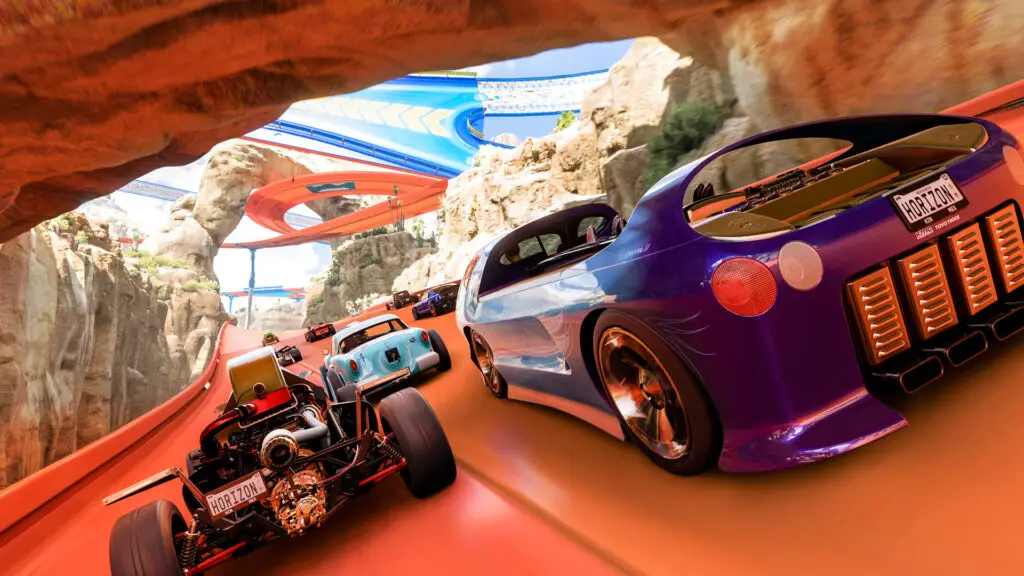 Cars on an orange track in the Hot Wheels DLC for Forza Horizon 5