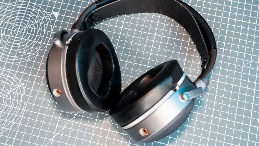 Two pairs of headphones. One, a SteelSeries set with ANC; the other, an Audeze set with great passive sound isolation.