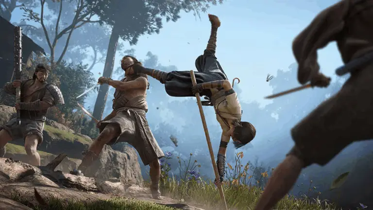 Eivor fights a group of enemies using a bo staff in Assassin's Creed Valhalla.