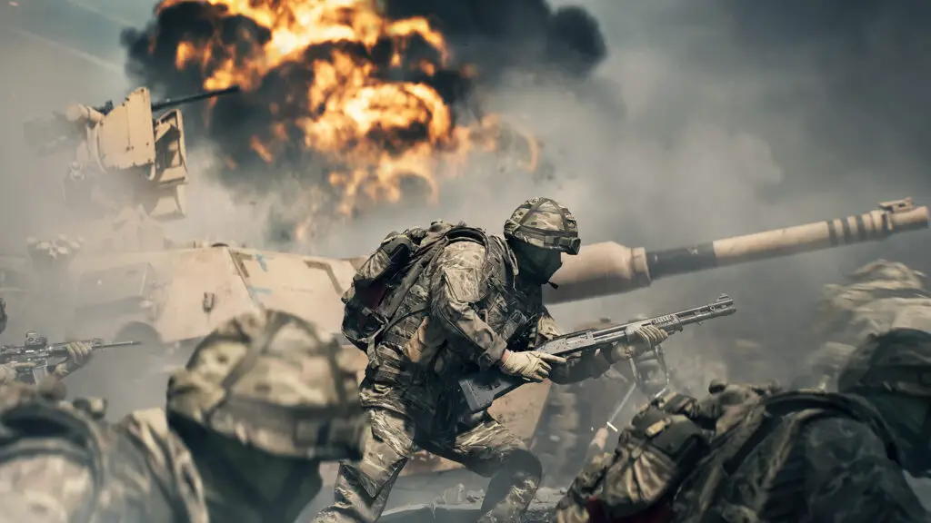 Soldiers huddle by a tank as an explosion erupts in the distance in Battlefield 6.