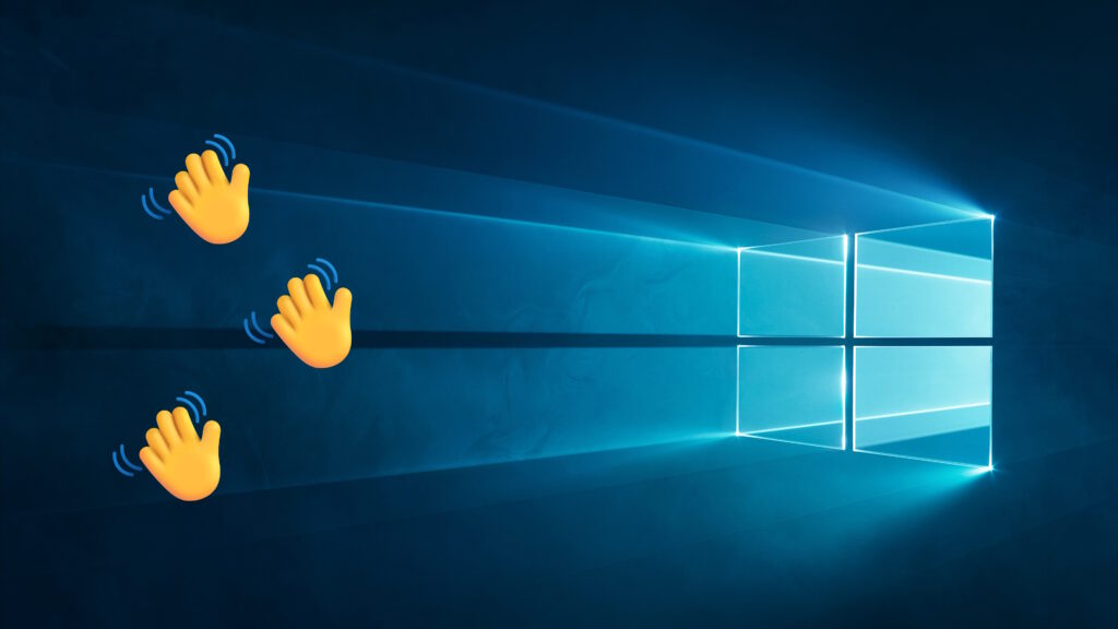 Emoji hands waving goodbye to the Windows 10 wallpaper