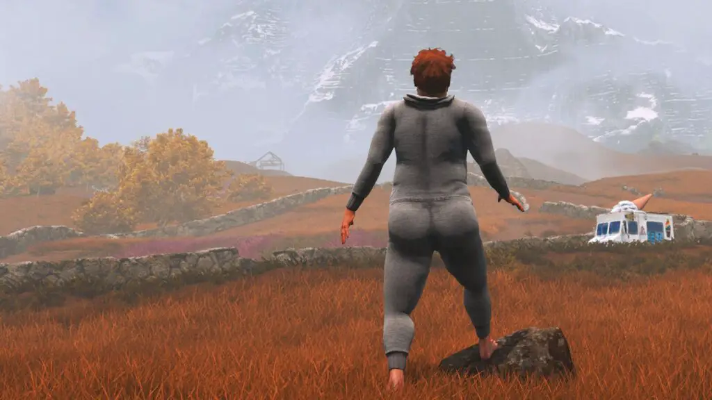 Nate in his gray onesie looks at an ice cream truck and a distant mountain