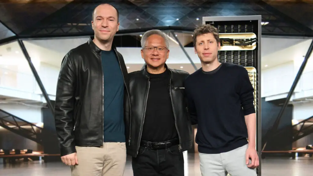 (L to R): OpenAI President Greg Brockman, NVIDIA Founder and CEO Jensen Huang, and OpenAI CEO Sam Altman are seen standing side by side.