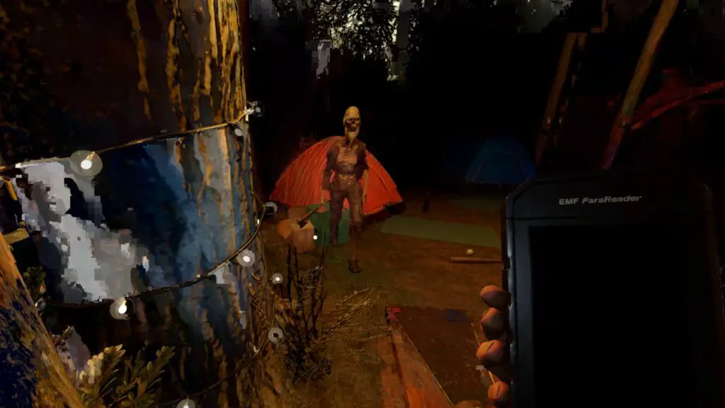 A ghost standing just outside the red small tent at Phasmophobia's Camp Woodwind map.