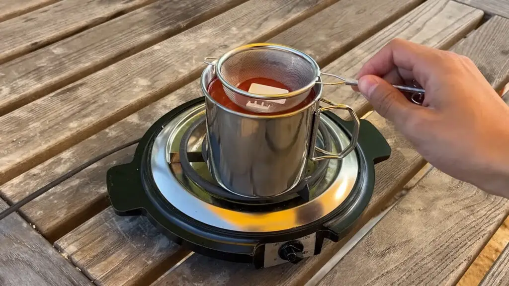 A still from a YouTube video showing a DIY custom keycap dyeing process