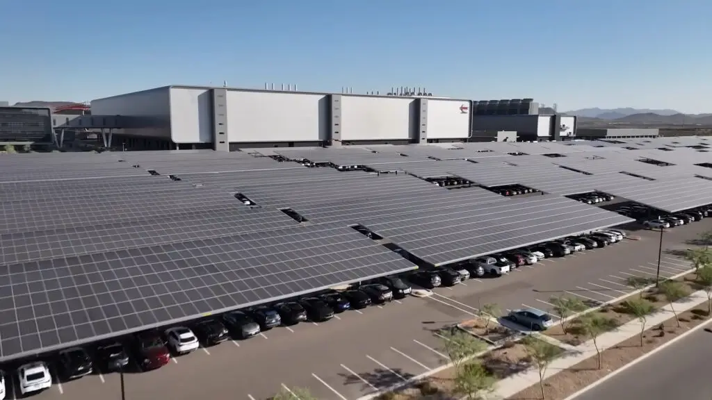 A screenshot from a promotional video showing the outside of TSMC's Arizona chip fabrication facility