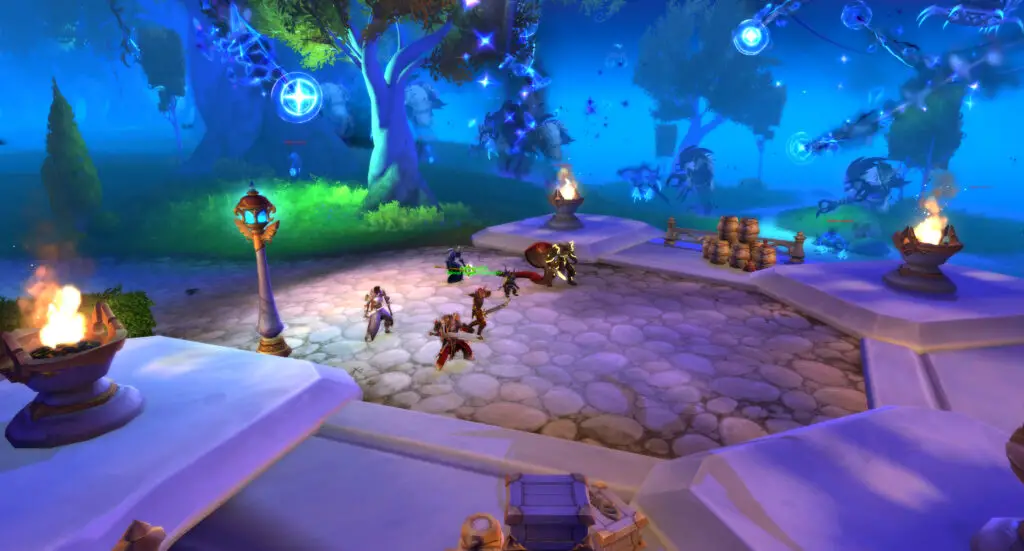 A screenshot of the World of Warcraft: Midnight alpha. A group of NPCs ready for battle on a cobblestone patio at dusk.