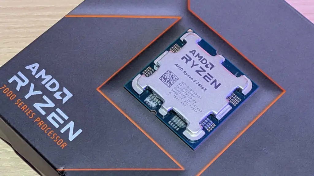 A stylized photo of an AMD Ryzen 5 7600X processor.