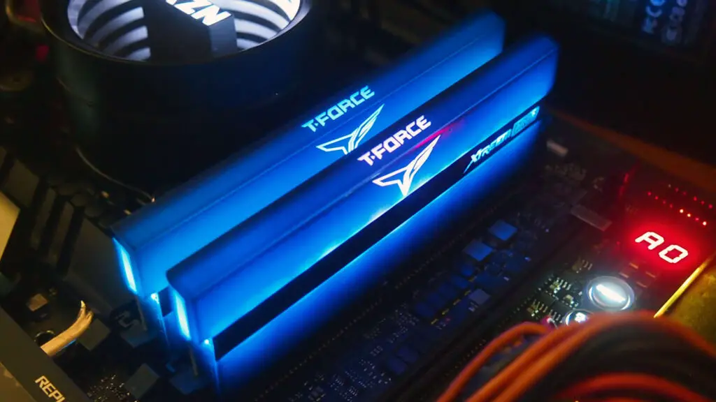 Two TEAM XTREEM ARGB RAM sticks lit up blue inside a PC