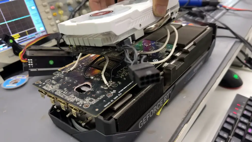 An RX 580 wired into the back of an RTX 5070 Ti