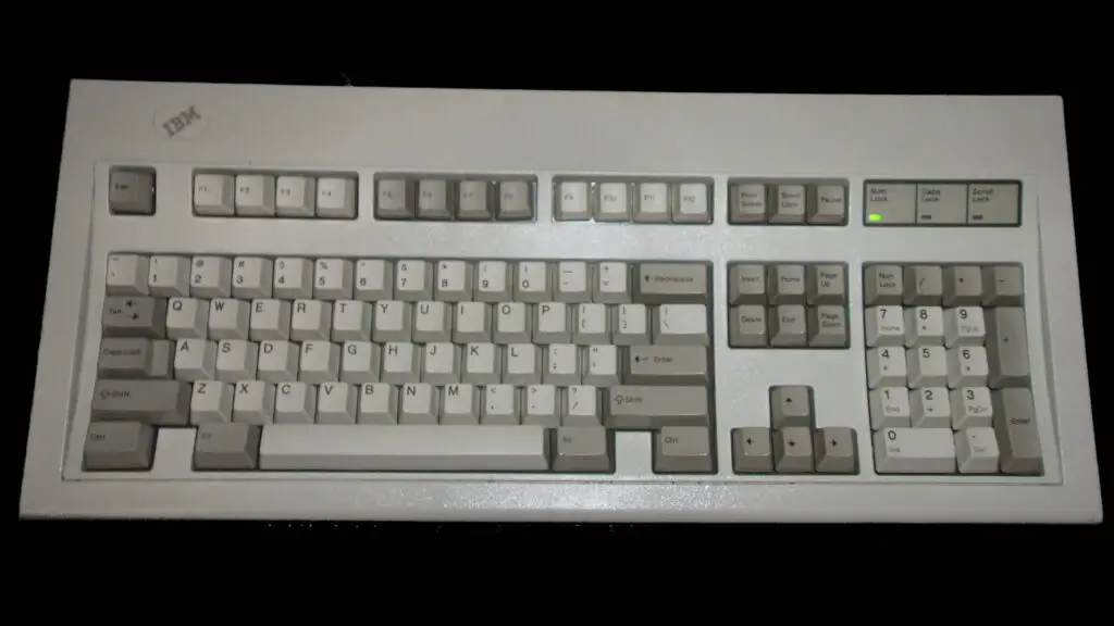 IBM Model M keyboard, Part no. 1391401, on a black background.