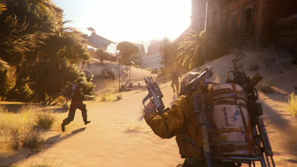 Arc Raiders olive locations: Three raiders running with guns in their hands through Buried City, an urban environment flooded with sand.