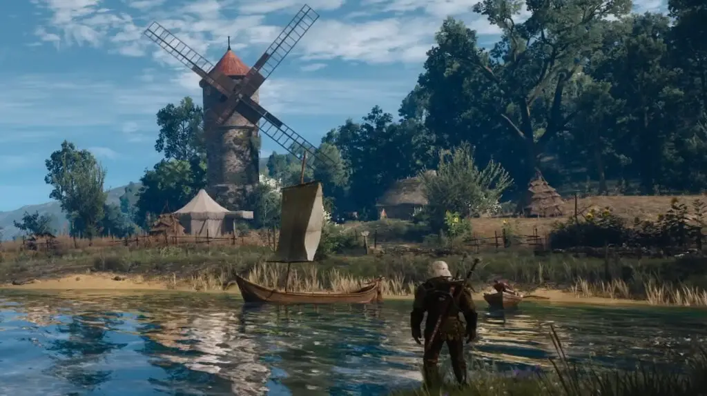 Geralt of Rivia from The Witcher 3 standing stoically in front of a vast lake, hinting at the game's expansive environments.