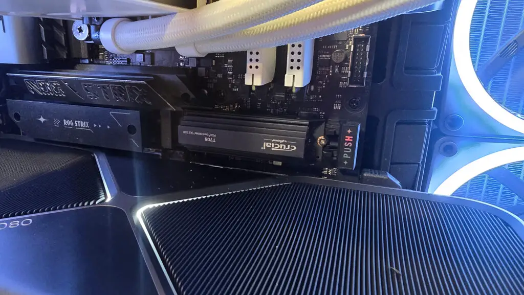 Crucial T705 NVMe SSD on a desk.