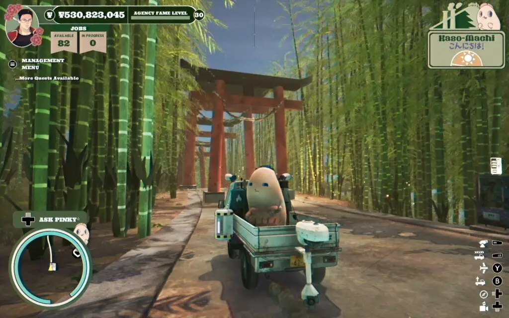 A truck drives through a bamboo forest with a mascot in the back