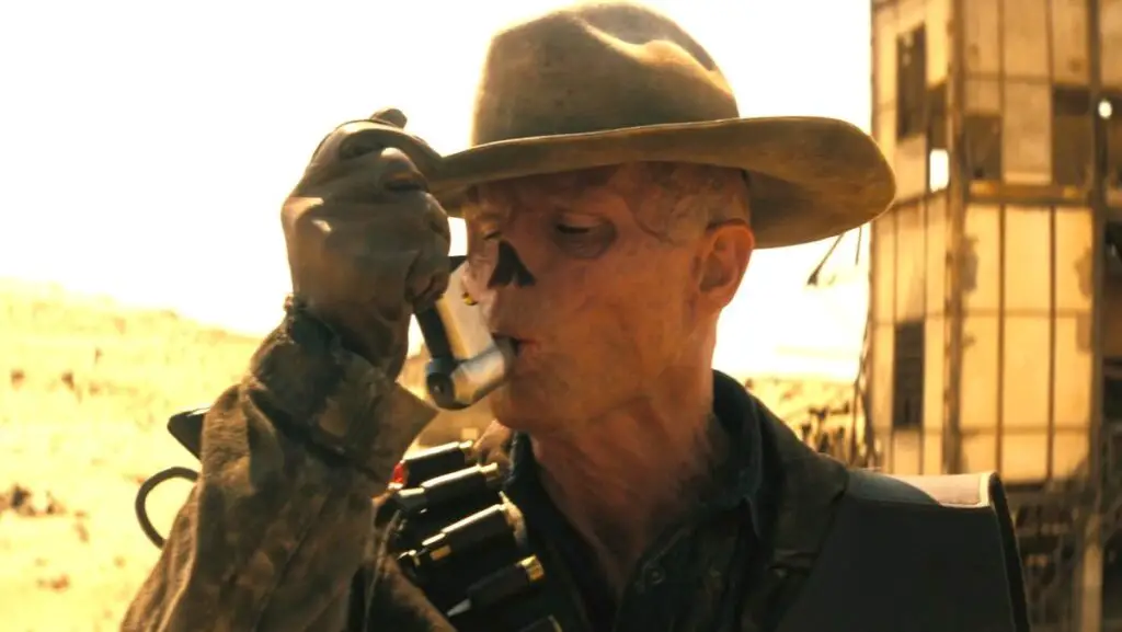 The Ghoul from the Fallout TV series inhaling a drug to prevent turning feral, looking rugged.