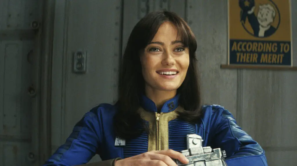 A person smiling and using a wrist computer, reminiscent of a Pip-Boy in the Fallout series.