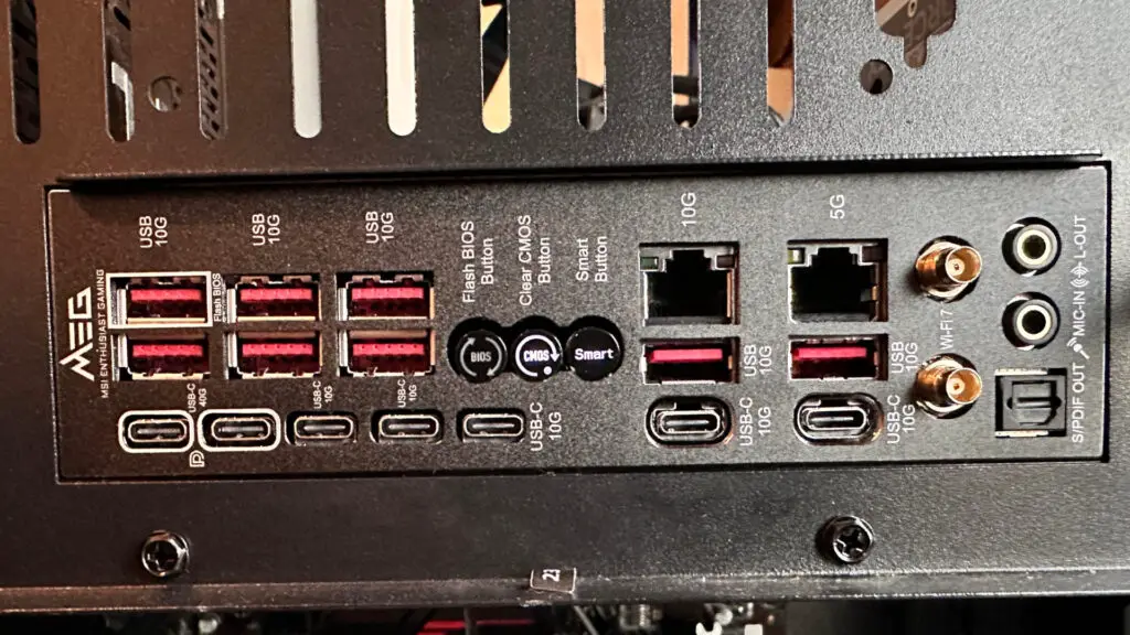 A photo showing the rear IO panel of an MSI MEG X870E Godlike X Edition motherboard