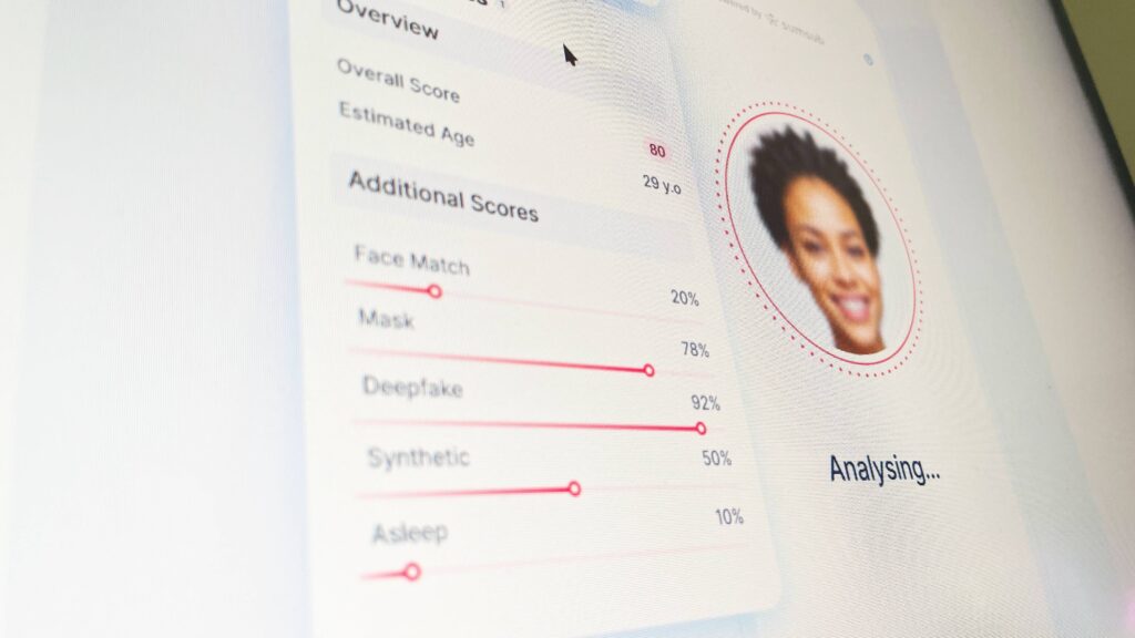 A screen showing Sumsub's home page with face verification analysis.