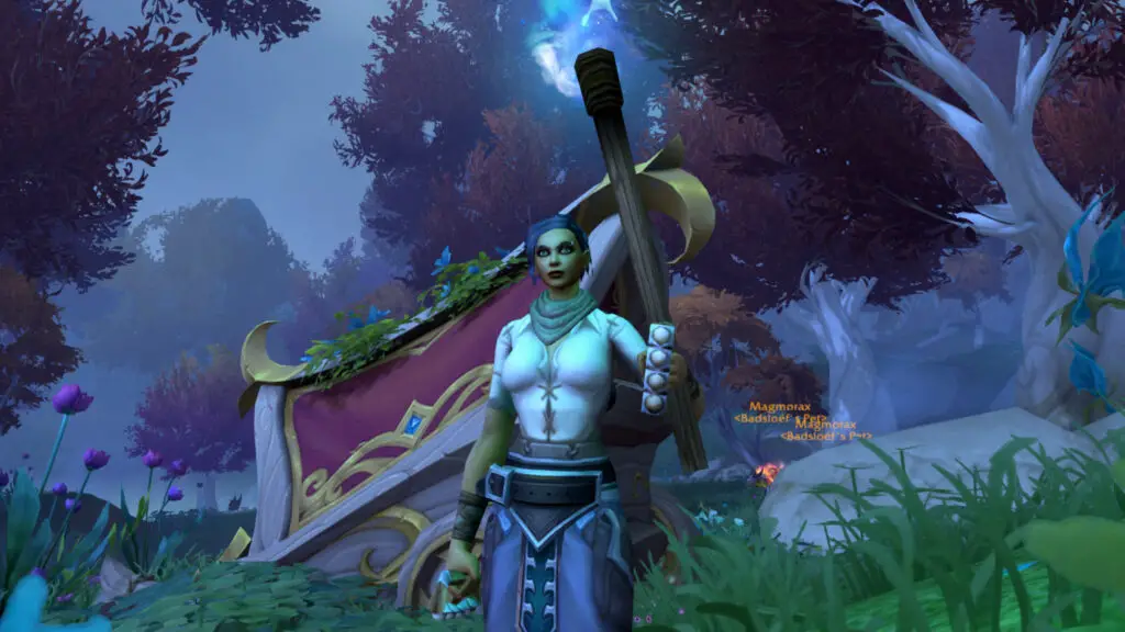 WoW triple-locked safebox: A player stood next to a broken cart in Eversong Woods holding a torch.