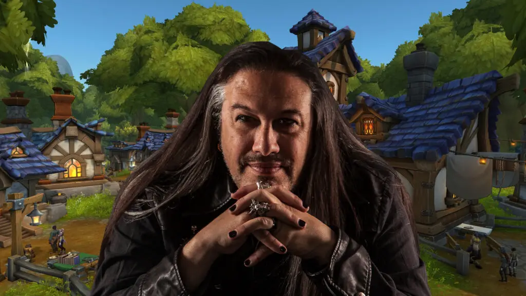 John Romero sitting in front of a WoW backdrop