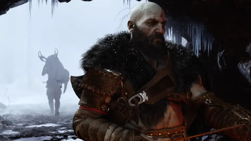 Kratos and Atreus in a frigid cave in God of War Ragnarok