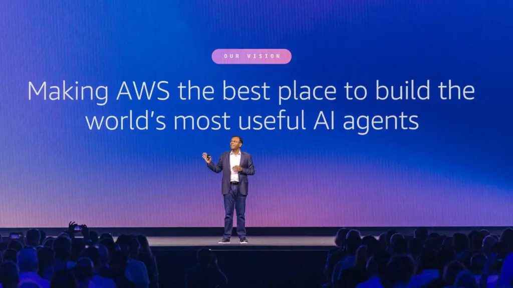 A photo of Swami Sivasubramanian, Amazon's VP of Agentic AI, standing on a stage with a background behind him stating 'Making AWS the best place to build the world's most useful AI agents'