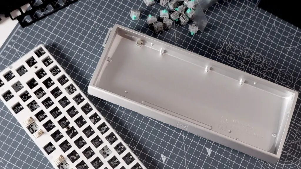 The Wooting 60HE v2 components spread out for assembly.