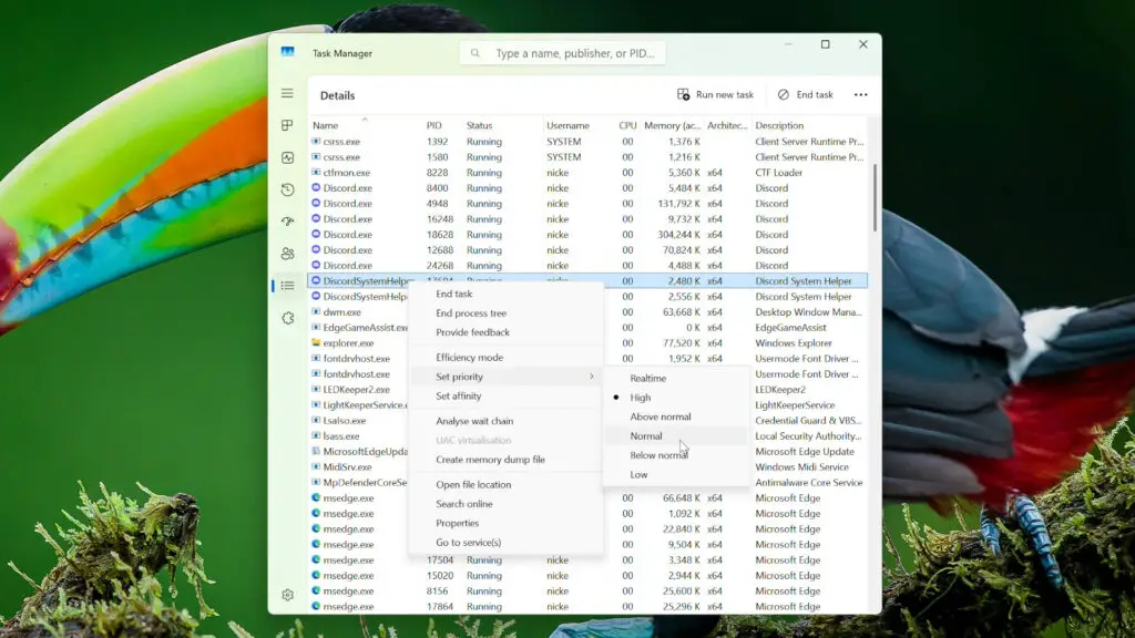 A screenshot of Windows 11's Task Manager showing Discord process priority settings.