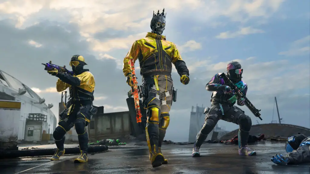 Three stylishly dressed soldiers show off their weapons in a warzone