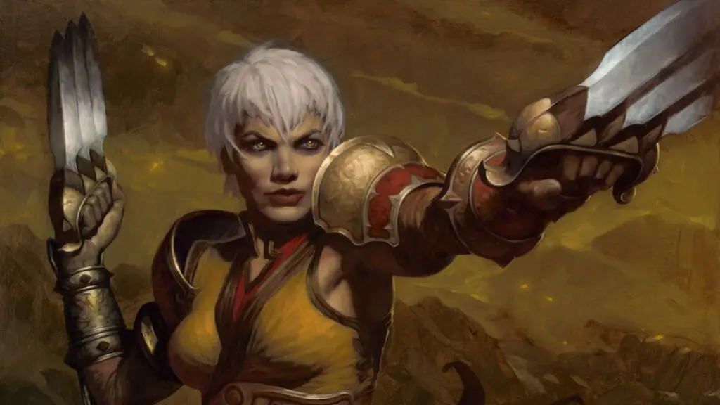 A monk holds a pair of bladed fist weapons