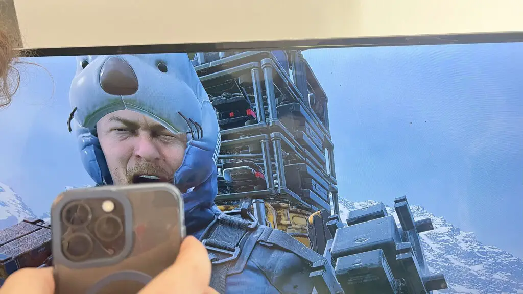 A user looking at a phone in frustration