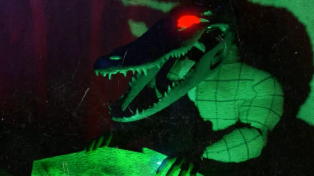 A surreal green lit alligator with red eyes in Moves of the Diamond Hand