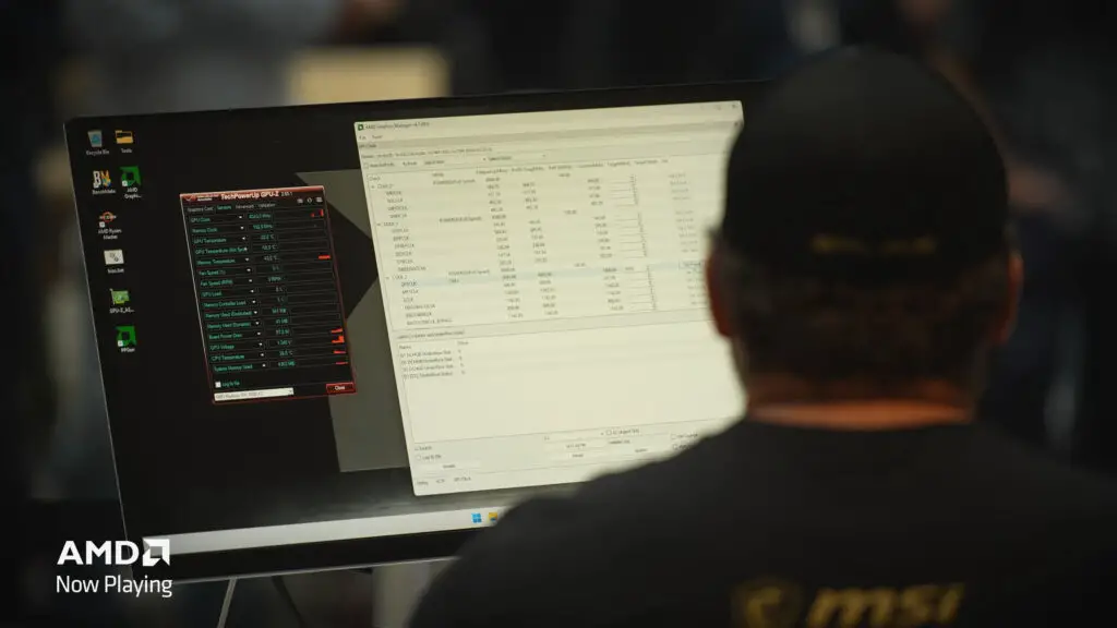 A screenshot of a YouTube video by AMD, showing top overclocker Splave looking at a monitor displaying overclocking software