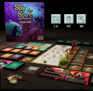 The Slay the Spire Downfall board game expansion laid out on a table.