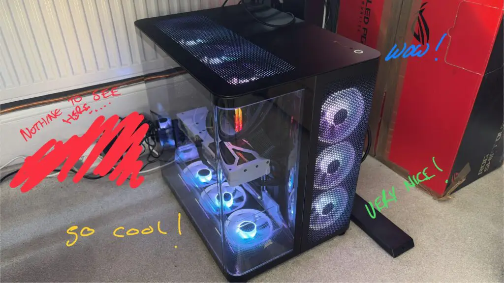 A gaming PC placed on the floor beside a desk