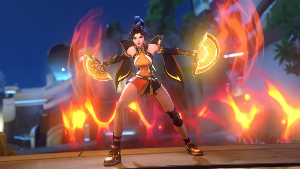 Overwatch: Anran standing in a powerful pose with her arms outstretched holding her flaming fans.