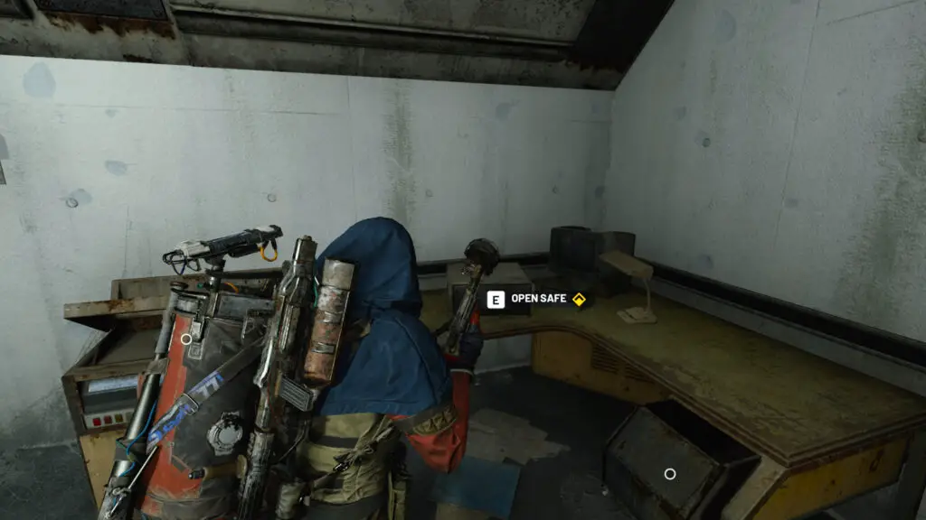 Arc Raiders Stable Housing: A player looking at a locked safe on a table in a dingy room.
