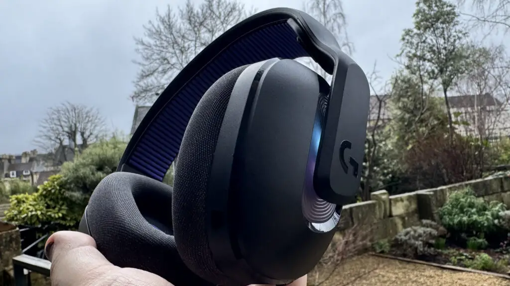 Logitech G522 Lightspeed gaming headset showing the logo in an outdoor setting