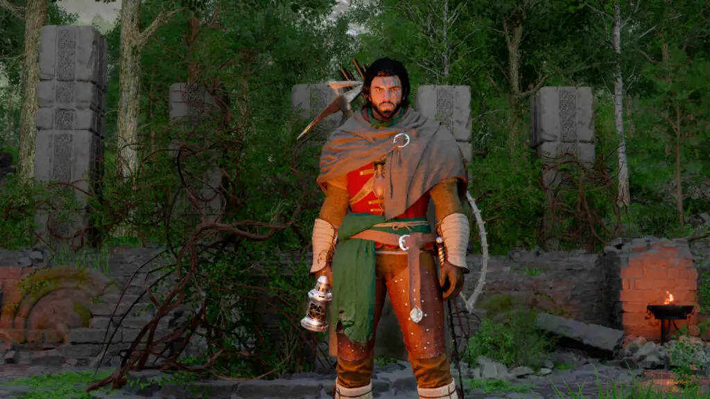 Kliff standing in the Duskwood Hill Ruins in the forest, with various pillars and a turnstile behind him.