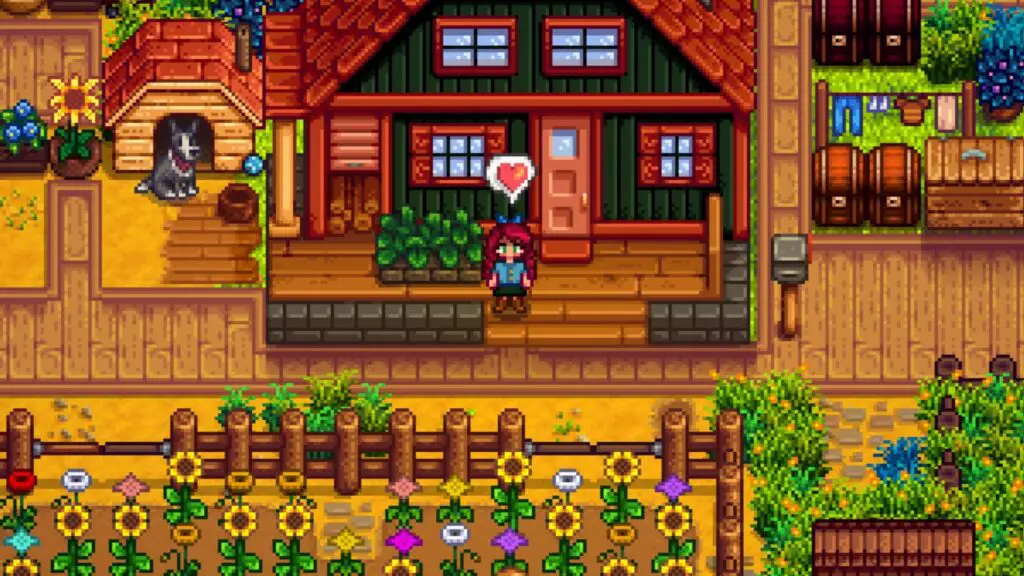 Stardew Valley player character standing outside of a green farm house with a heart over her head. Nearby, there's a black and white dog, and the farm is full of flowers and greenery.