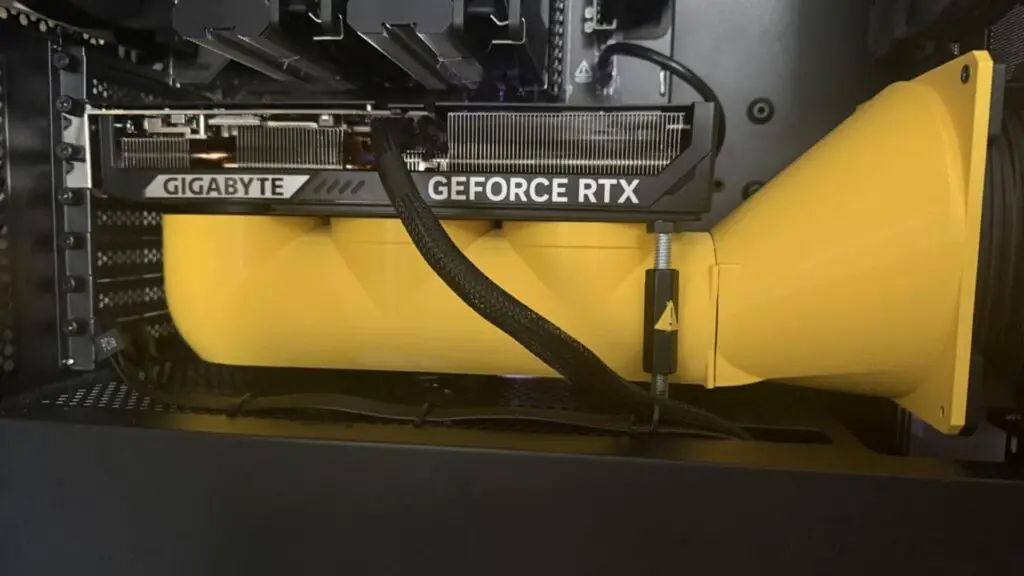 A 3d printed yellow air duct for a gaming pc, from Reddit user 'Esra-Zander'