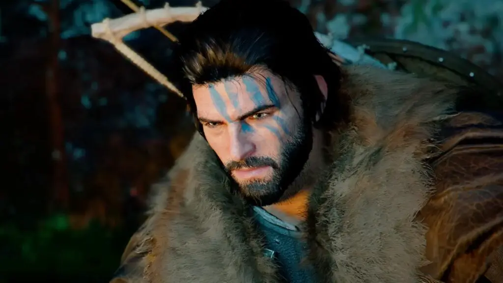 Kliff, the Crimson Desert protagonist. He has four blue stripes across his face, mid-length black hair, and is looking solemnly at the ground. 