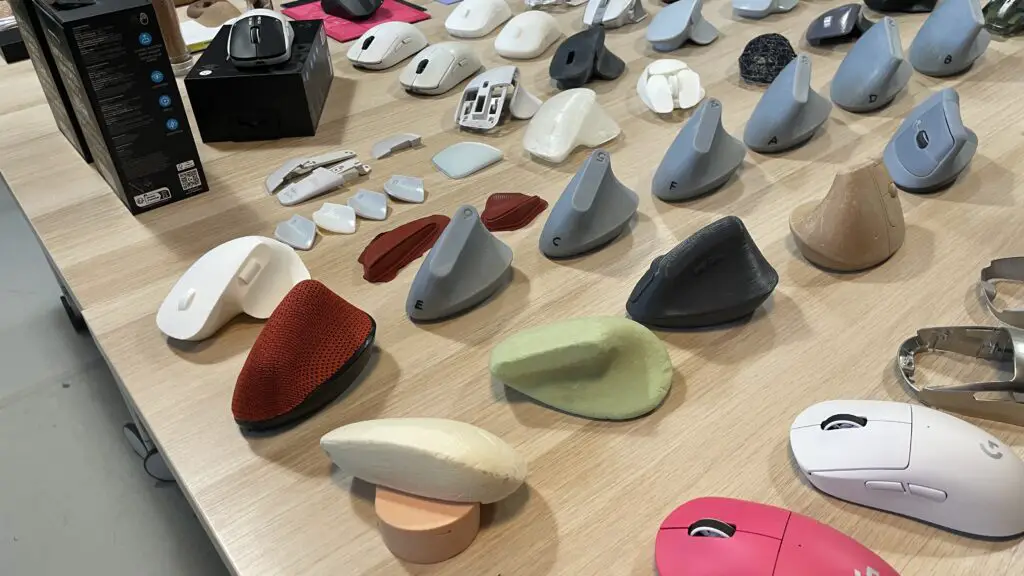A range of Logitech mice prototypes and finished designs on a large engineering table