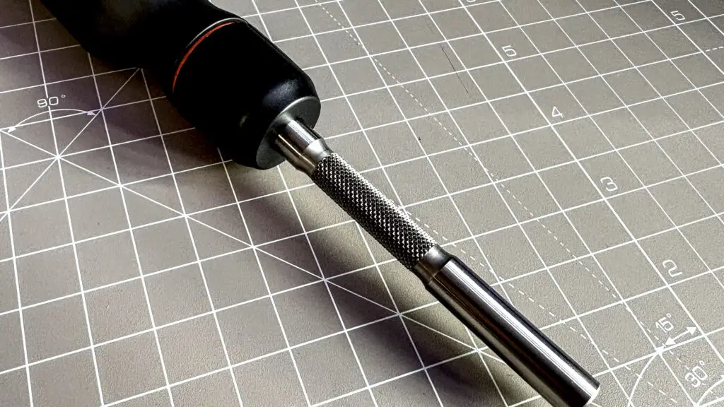 Two screwdrivers on a desk with orange highlights, sold by the YouTube channel Linus Tech Tips, or LTT for short.