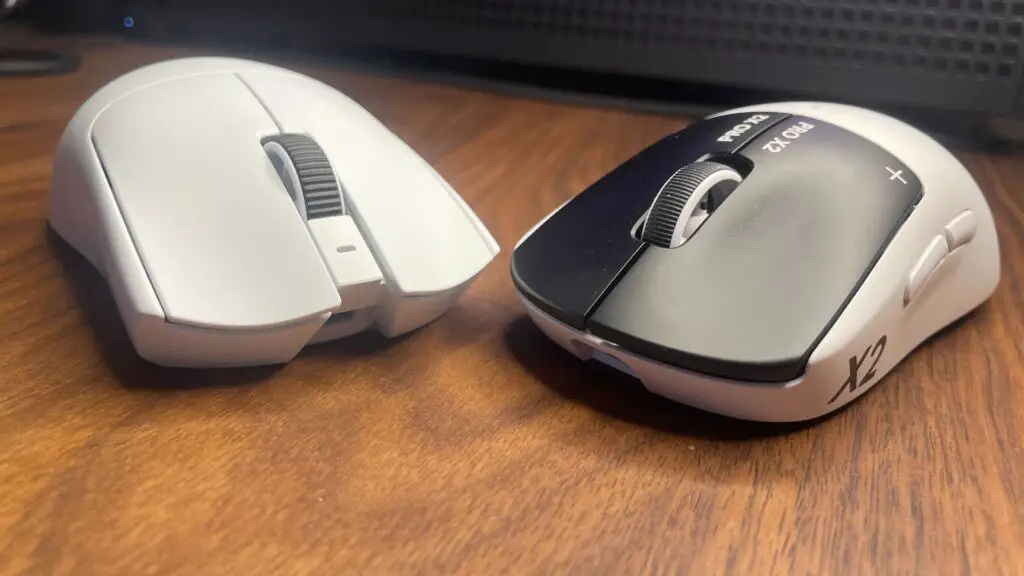 A Razer Viper V4 Pro side-by-side with a Logitech G Pro X2 Superstrike for size comparison